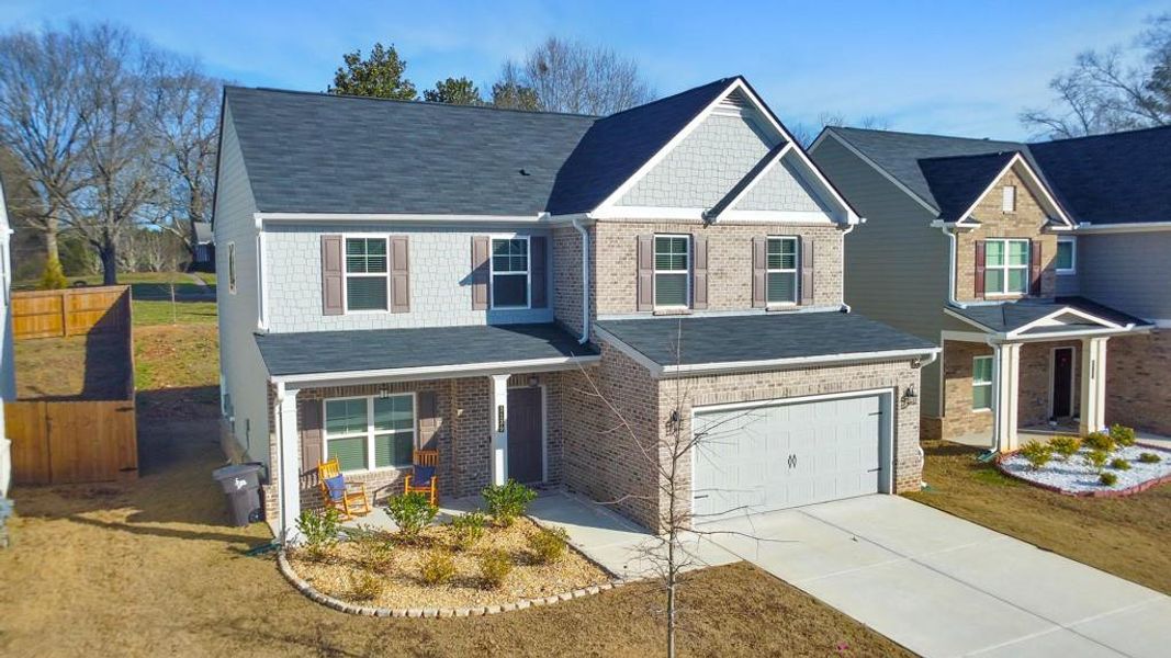 Front exterior of a new home in Old Lost Mountain Estates, Powder Springs, GA, highlighting curb appeal (Image 26).