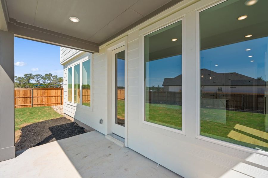 Exterior details and patio area of a home in Terrace Collection at Heritage, Dripping Springs (Image 23).