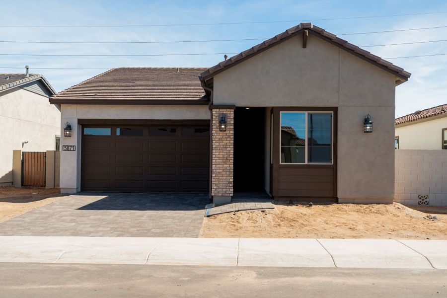 Front exterior of a new home in Waterston Central, Gilbert, AZ, highlighting curb appeal (Image 1). Front exterior of a new home in Waterston Central, Gilbert, AZ, highlighting curb appeal (Image 1).