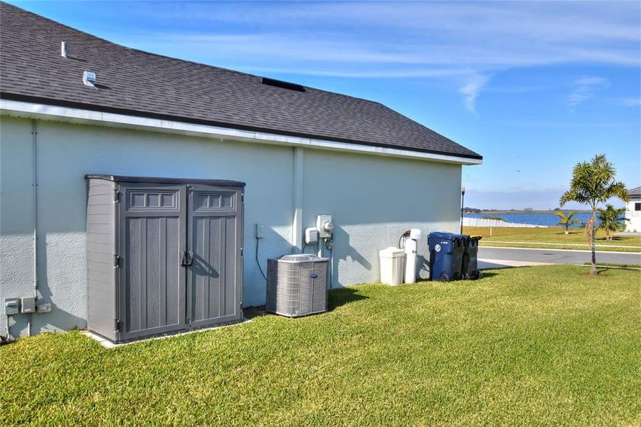 Side of property, Shed, HVAC, and Water Softener.