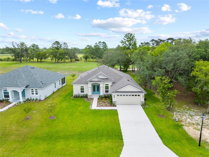 Front exterior of a new home in , Homosassa, FL, highlighting curb appeal (Image 18).