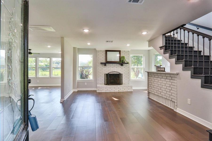 A First-Class Luxury Designer. Stunning "Bruce Dogwood" engineered wood flooring in the entrance and den; Sherwin Williams paint throughout entire home and garage.