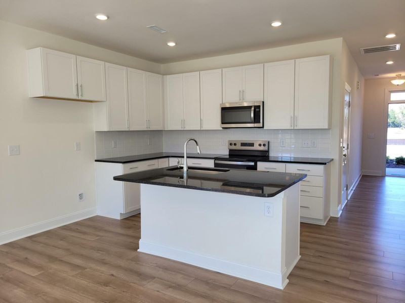 Furnished interior view inside a new home in 1158 Place Townhomes, Wilson (Image 6).