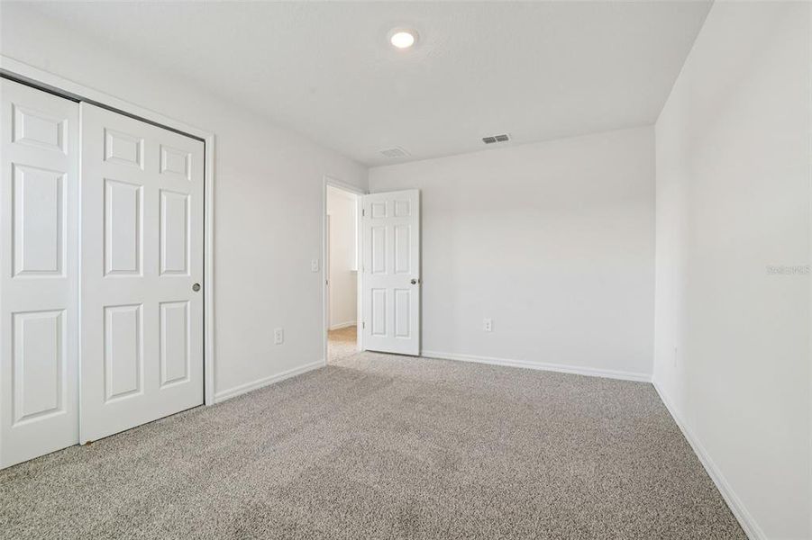 Spacious, unfurnished interior of a new home in Lake Deer Estates - Signature Series, Poinciana (Image 36).