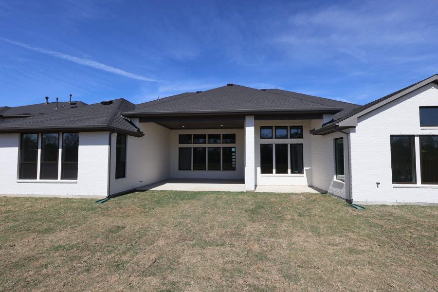 Exterior details and patio area of a home in Woodson’s Reserve, Spring (Image 3).