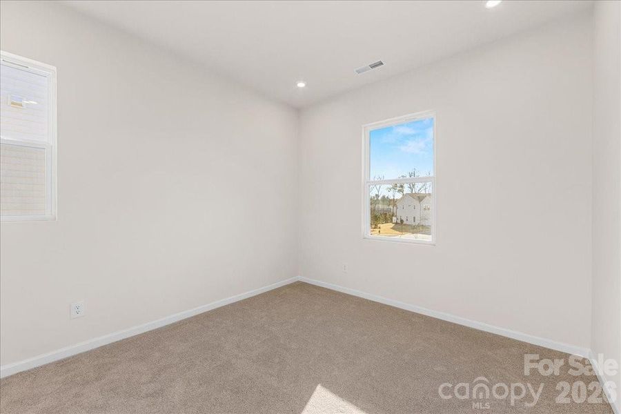 Secondary Bedroom with 9' Ceilings.