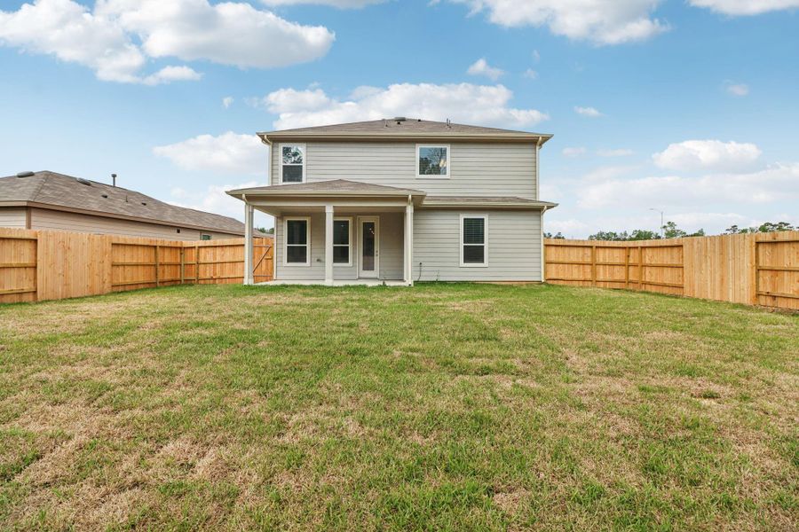 Enjoy outdoor living under the covered patio! A great space to put patio furniture and your BBQ grill to entertain family and friends.