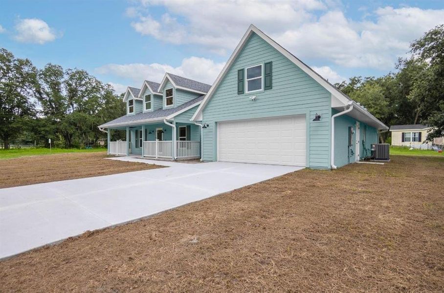 Front exterior of a new home in , Webster, FL, highlighting curb appeal (Image 23).