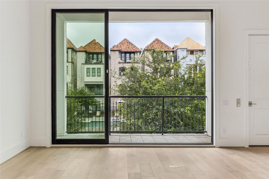 Second floor has soaring 12' ceiling heights. The 10' sliding glass panels open up to the balcony that overlooks the pool and dog park area, like in this previous build. Second floor has soaring 12' ceiling heights. The 10' sliding glass panels open up to the balcony that overlooks the pool and dog park area, like in this previous build.