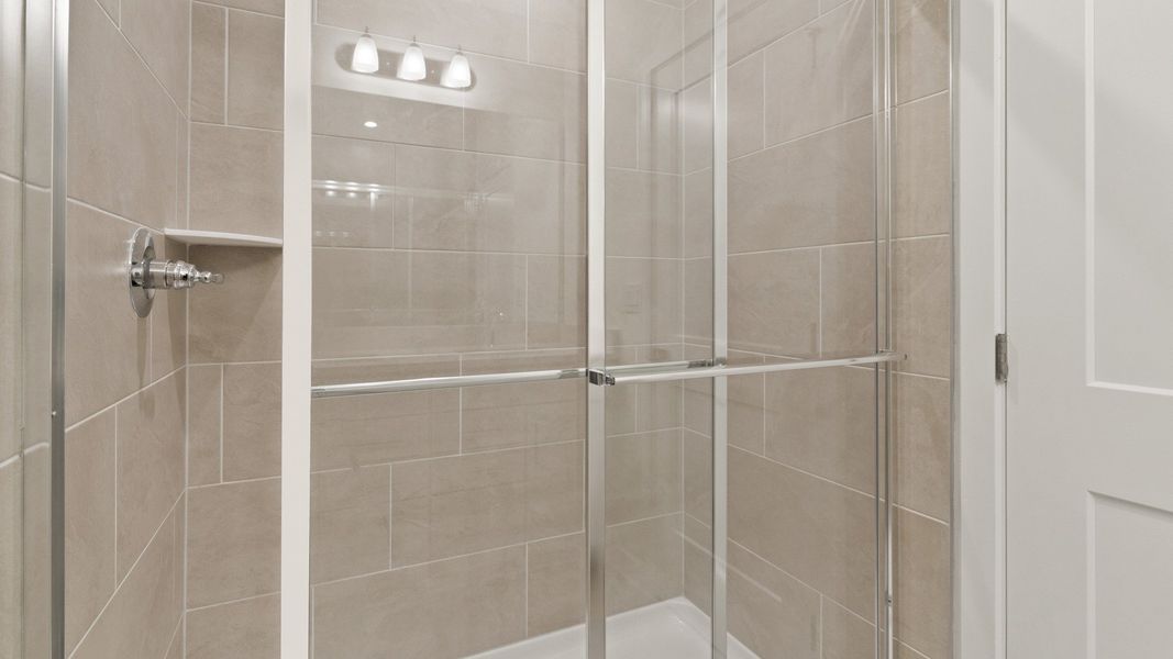 Primary En Suite Bath Walk-in Shower in the Flagler by DRB Homes in Hamilton Bluff Primary En Suite Bath Walk-in Shower in the Flagler by DRB Homes in Hamilton Bluff