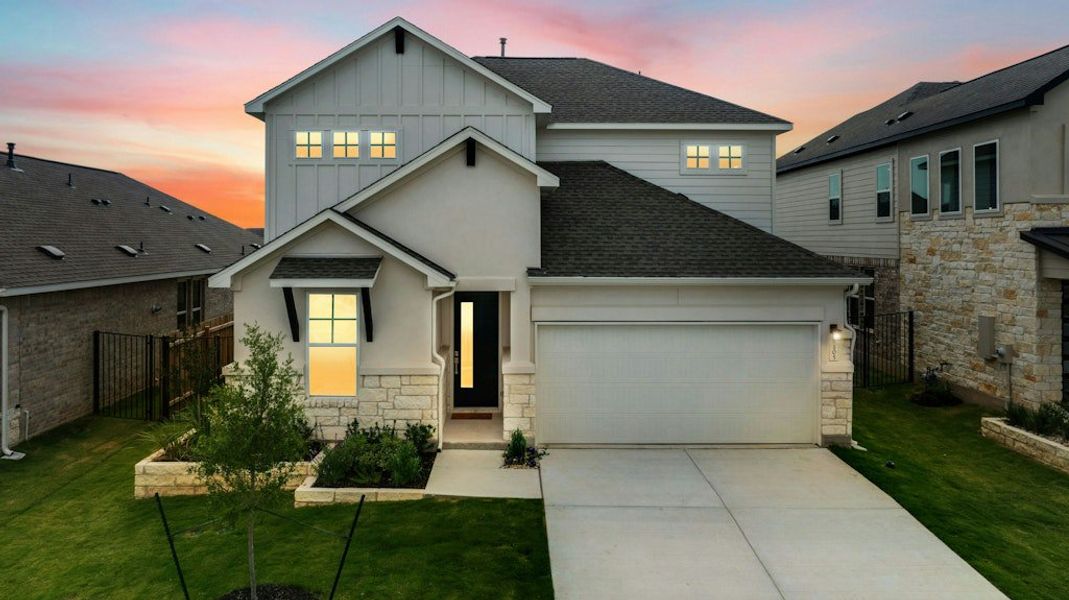Front exterior of a new home in Santa Rita Ranch, Liberty Hill, TX, highlighting curb appeal (Image 18).