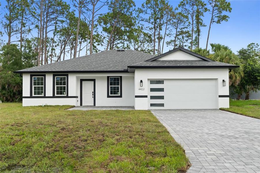 Front exterior of a new home in , North Port, FL, highlighting curb appeal (Image 1).