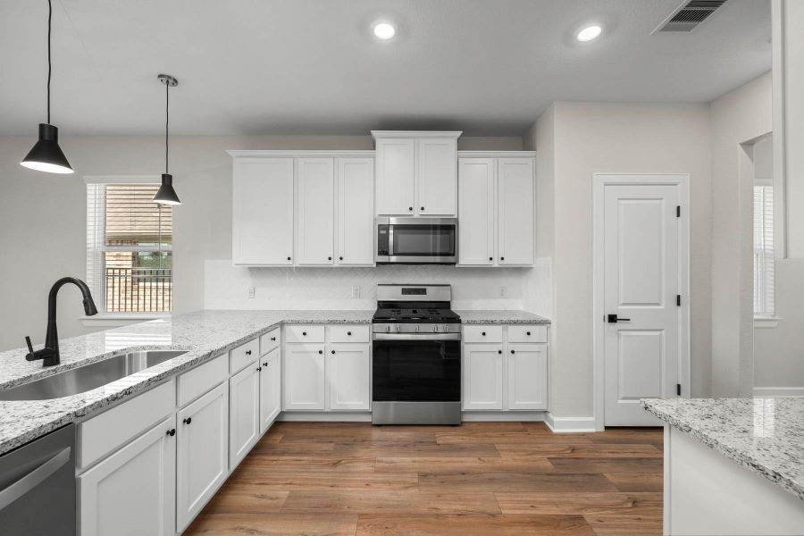 Furnished interior view inside a new home in Sunterra, Katy (Image 3).