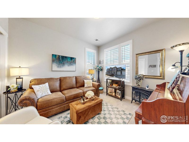 Furnished interior view inside a new home in The Lakes at Centerra - Discovery, Loveland (Image 17).
