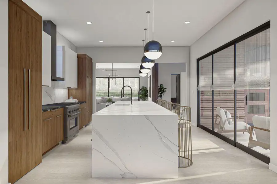 Kitchen with an island with sink, brown cabinets, a sink, and high end stove