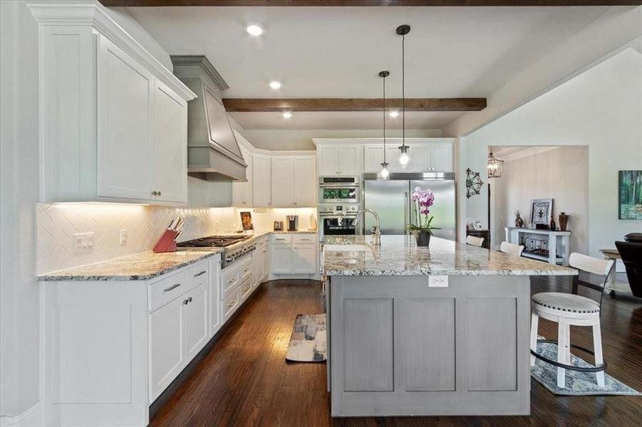 Kitchen sample.  This home owner added the custom hood, larger island and the sub zero fridge. These features aren't standard, but can be added.