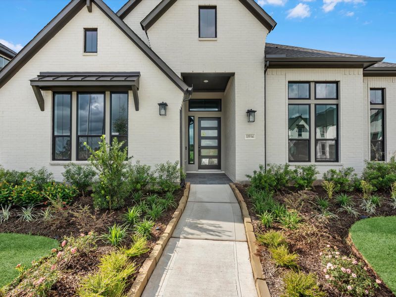 Front exterior of a new home in Sienna 80′, Missouri City, TX, highlighting curb appeal (Image 17).