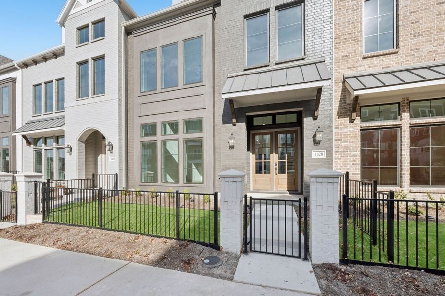 Exterior details and patio area of a home in Newman Village Townhomes, Frisco (Image 21).