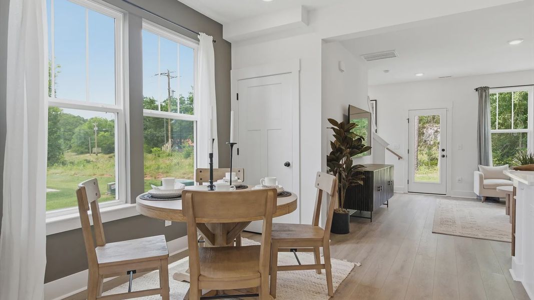 This casual dining area of the Churchill Design features a seamless layout that makes meals feel easy and welcoming