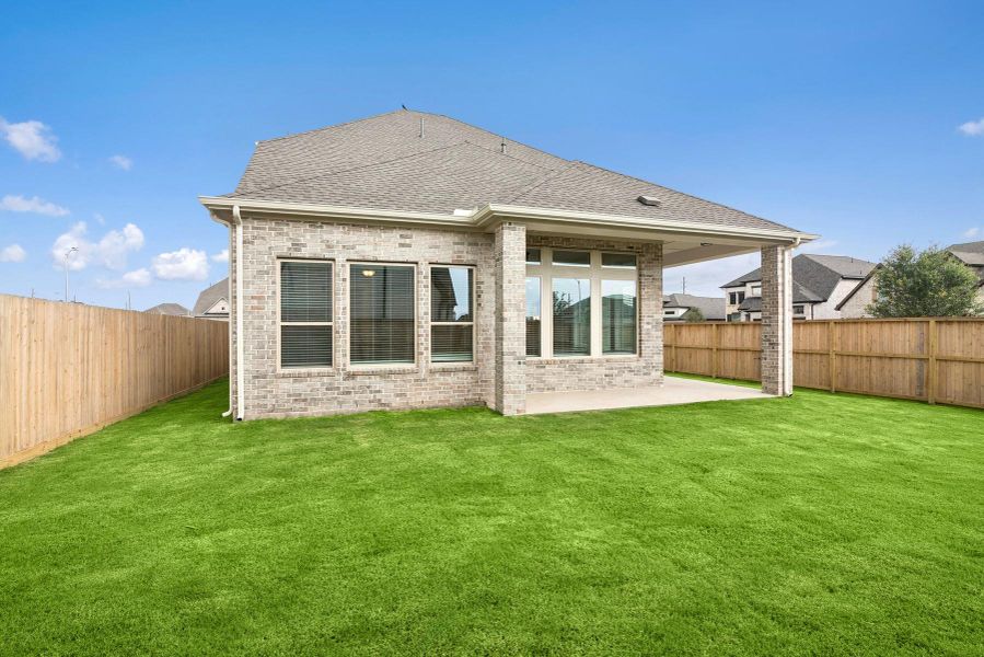 Front exterior of a new home in Harvest Green 45', Richmond, TX, highlighting curb appeal (Image 1).