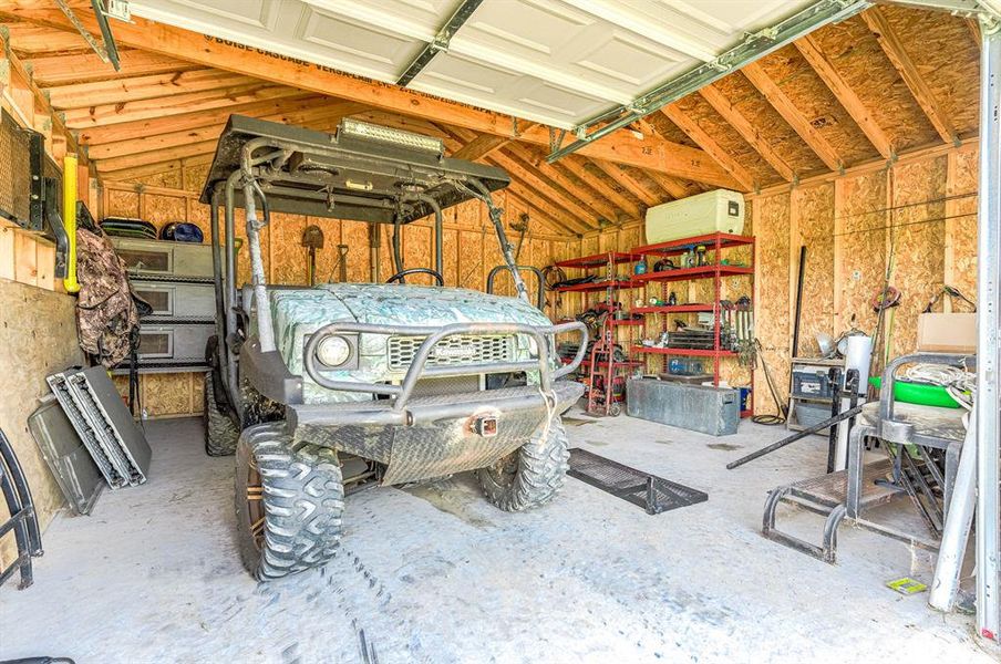 Inside the workshop - plenty of room for yard equipment and toys!