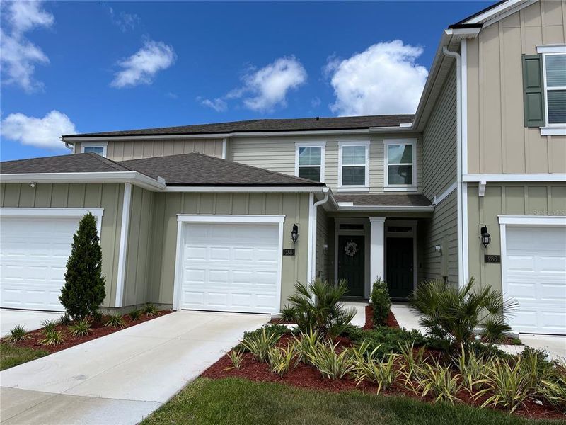 Front exterior of a new home in , Palm Coast, FL, highlighting curb appeal (Image 1). Front exterior of a new home in , Palm Coast, FL, highlighting curb appeal (Image 1).