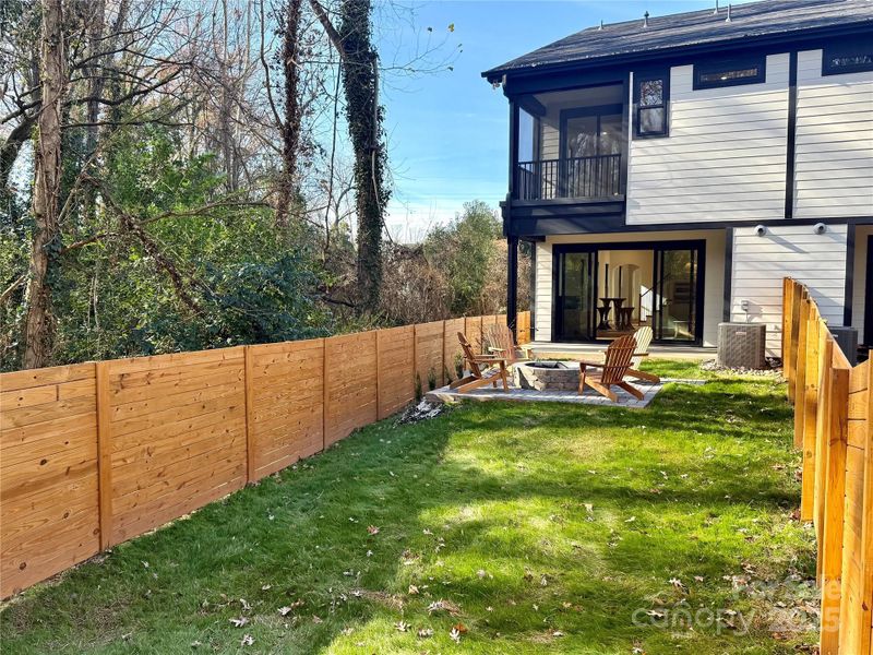 View of firepit and back of home View of firepit and back of home