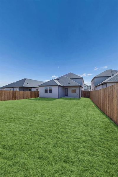 Covered Patio in the Oak II home plan by Trophy Signature Homes – REPRESENTATIVE PHOTO