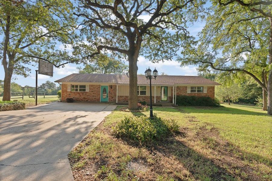 Front exterior of a new home in , Alvarado, TX, highlighting curb appeal (Image 17).