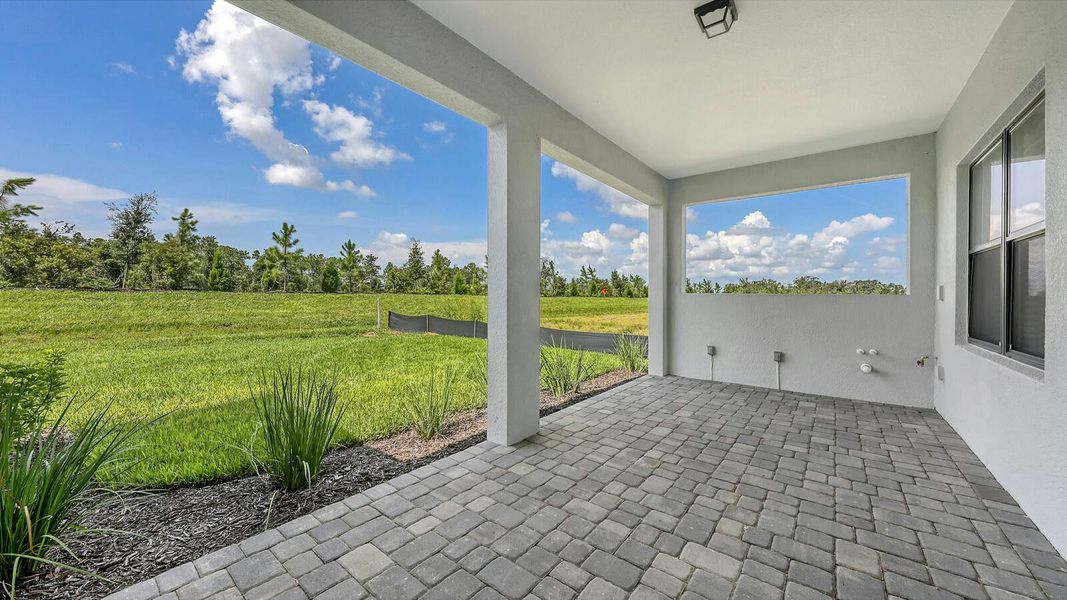 Exterior details and patio area of a home in Palm Grove Real Estate and Homes for Sale in Lakewood Ranch, FL - Neal Communities, Lakewood Ranch (Image 3).