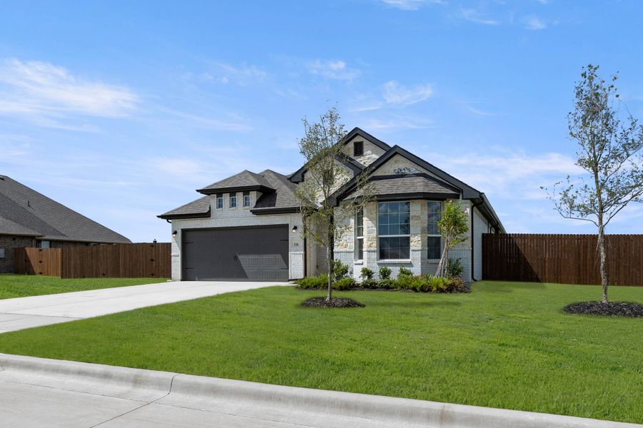 Front exterior of a new home in Coyote Crossing, Godley, TX, highlighting curb appeal (Image 2). Front exterior of a new home in Coyote Crossing, Godley, TX, highlighting curb appeal (Image 2).