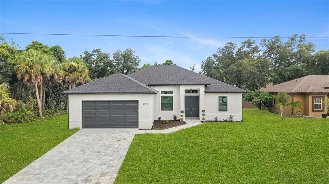 Front exterior of a new home in , North Port, FL, highlighting curb appeal (Image 2). Front exterior of a new home in , North Port, FL, highlighting curb appeal (Image 2).