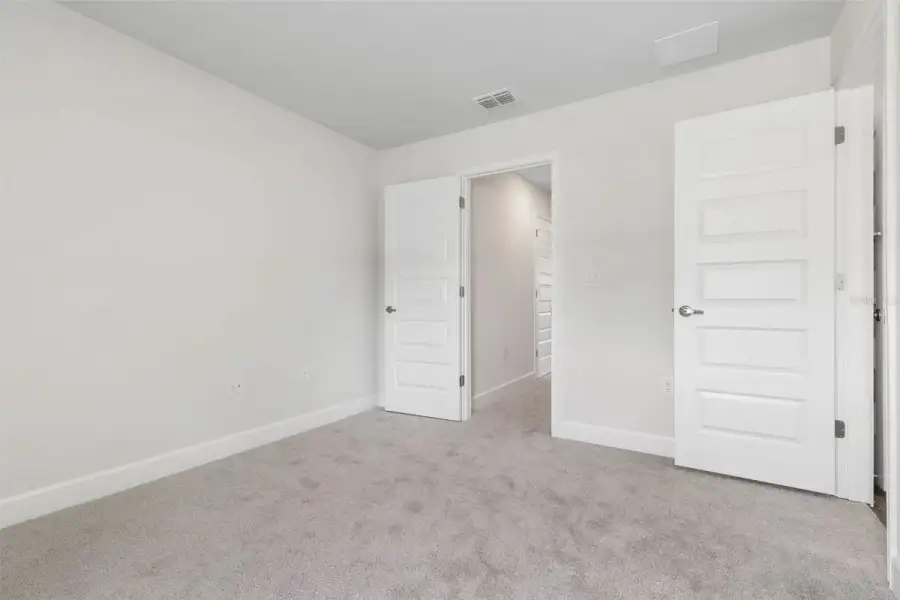 Representative unfurnished interior of a home built from the 2117 by Adams Homes in Flagler Estates, Hastings (Image 33).