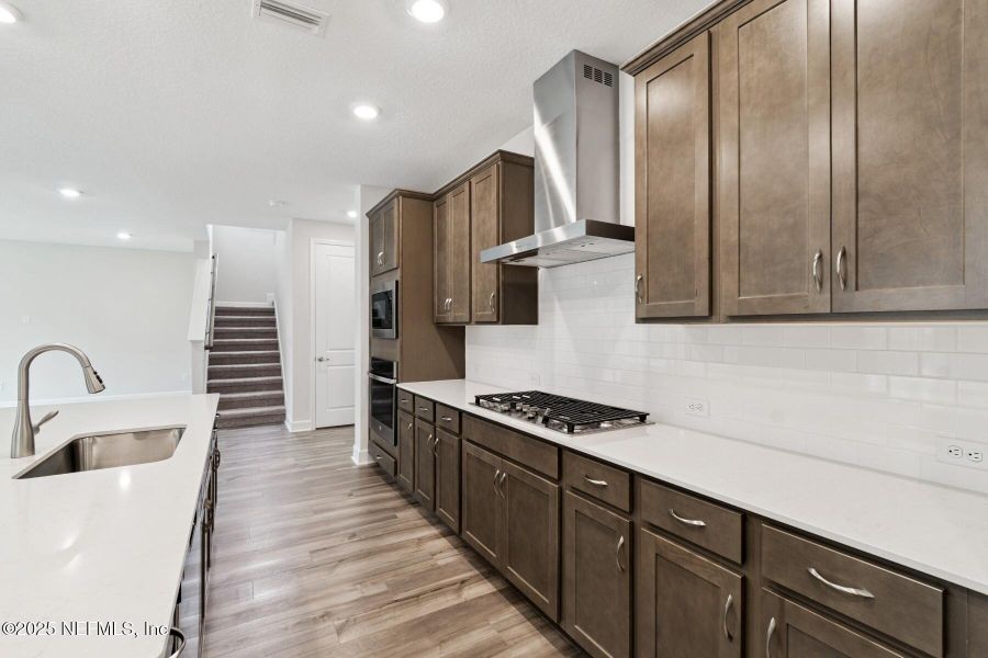 Furnished interior view inside a new home in Tributary 70', Yulee (Image 8).