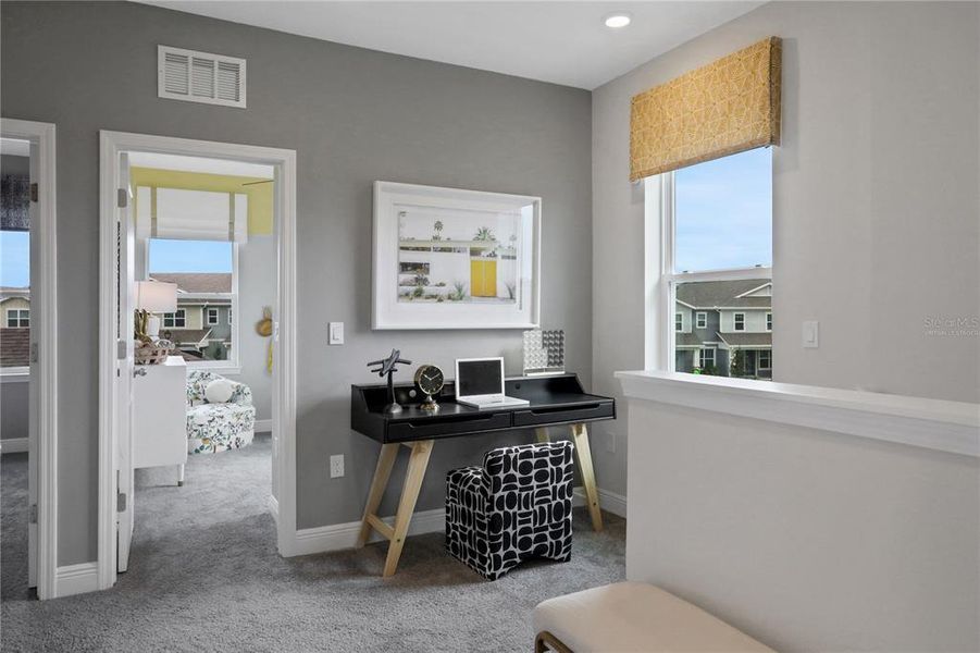 Furnished interior view inside a new home in Serenade at Ovation, Winter Garden (Image 13).
