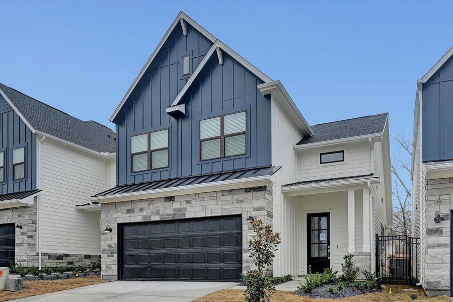 Front exterior of a new home in Summer Place 35', Montgomery, TX, highlighting curb appeal (Image 22). Front exterior of a new home in Summer Place 35', Montgomery, TX, highlighting curb appeal (Image 22).