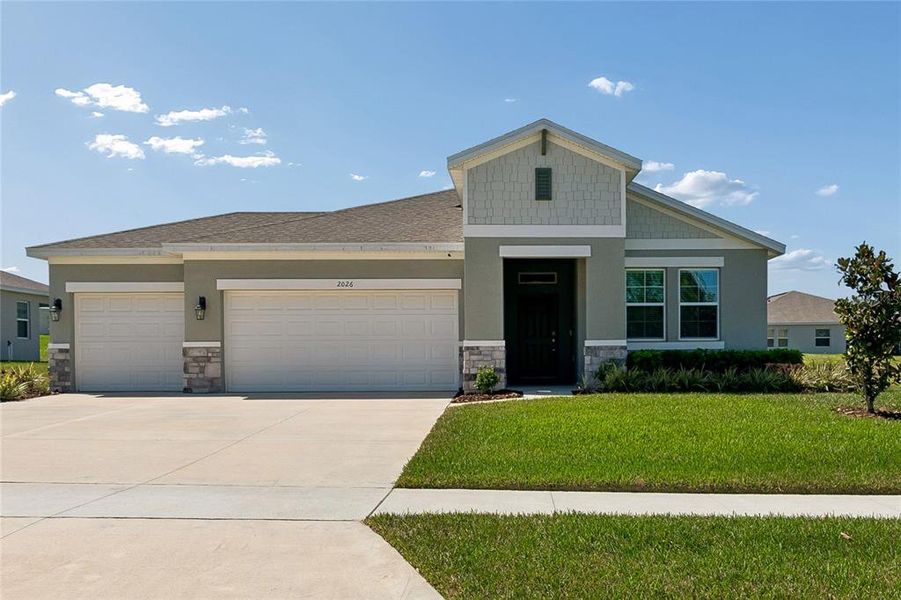 Front exterior of a new home in , Winter Garden, FL, highlighting curb appeal (Image 24). Front exterior of a new home in , Winter Garden, FL, highlighting curb appeal (Image 24).