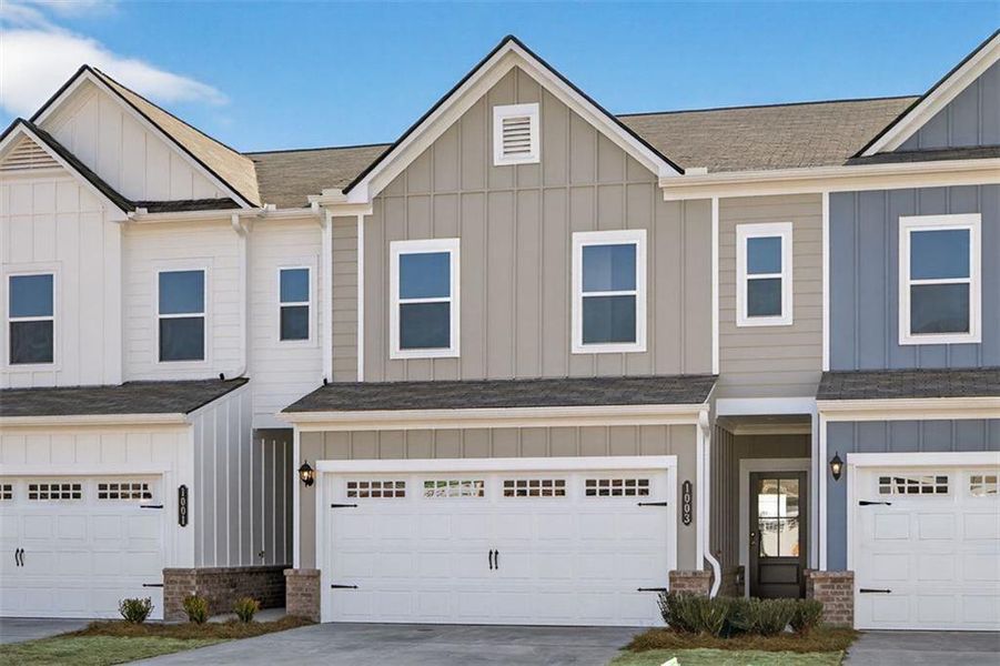 Front exterior of a new home in Townes At The Stiles, Cartersville, GA, highlighting curb appeal (Image 1). Front exterior of a new home in Townes At The Stiles, Cartersville, GA, highlighting curb appeal (Image 1).