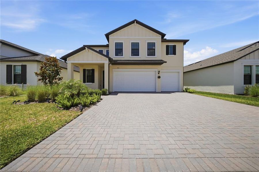 Front exterior of a new home in Connerton, Land O' Lakes, FL, highlighting curb appeal (Image 27).