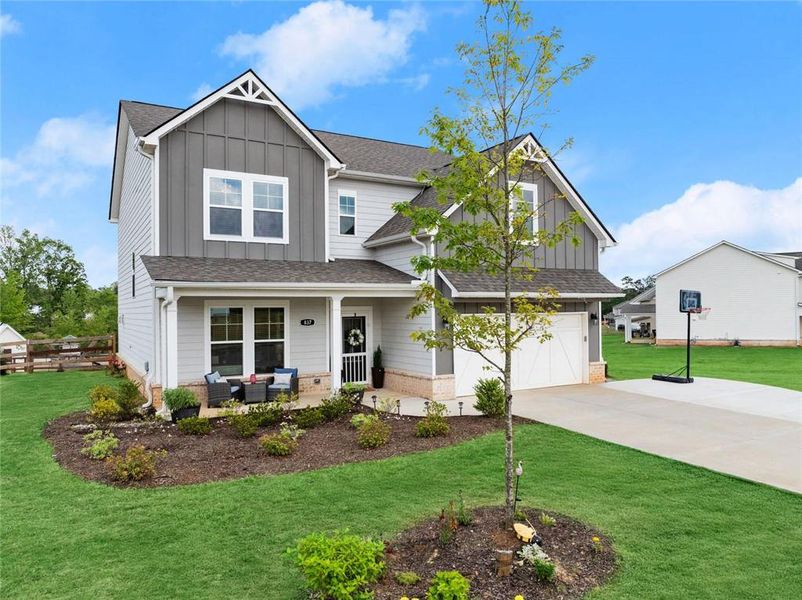 Front exterior of a new home in , Dacula, GA, highlighting curb appeal (Image 24).