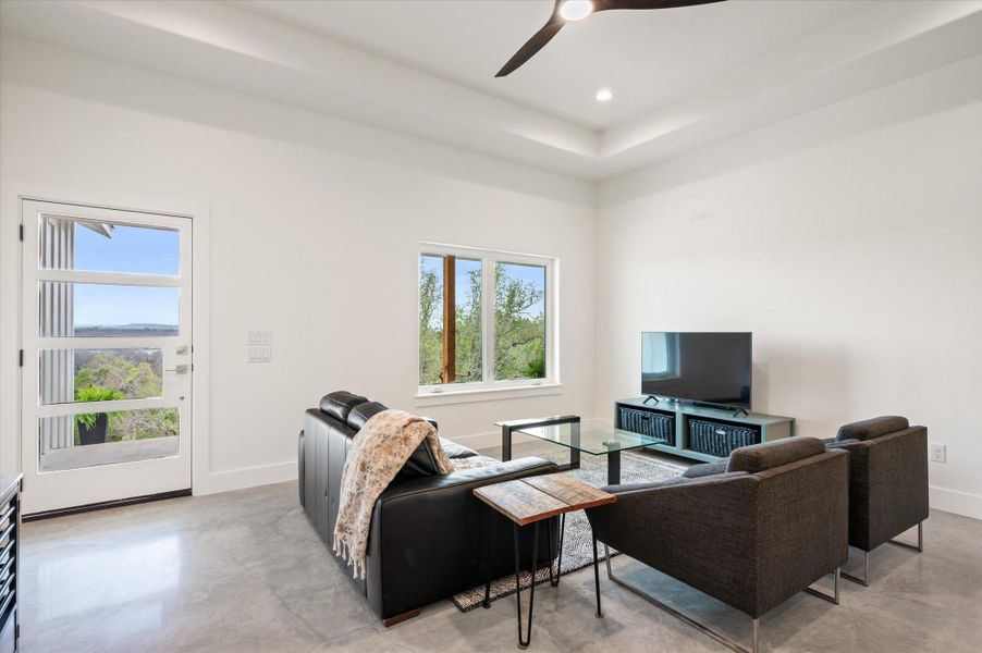 A spacious open living area with a day time and night time spectacular view