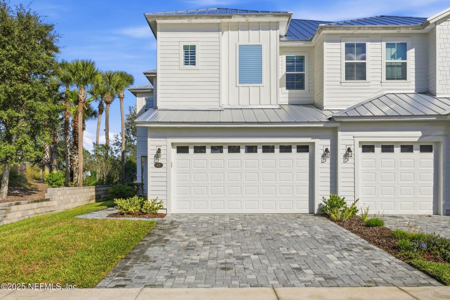 Front exterior of a new home in , St. Johns, FL, highlighting curb appeal (Image 24).