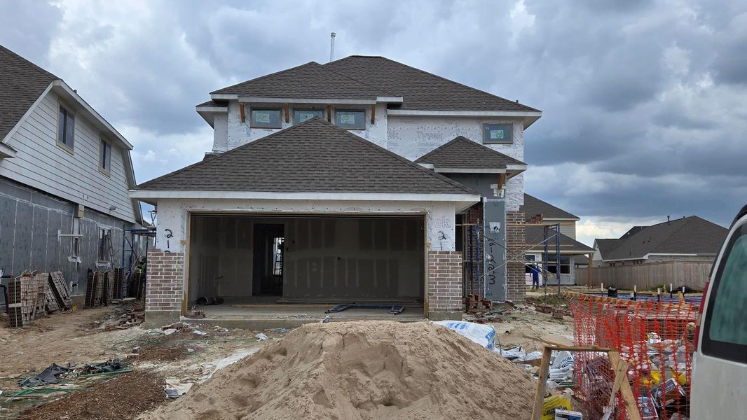 Front exterior of a new home in Bridgeland 40', Cypress, TX, highlighting curb appeal (Image 10).
