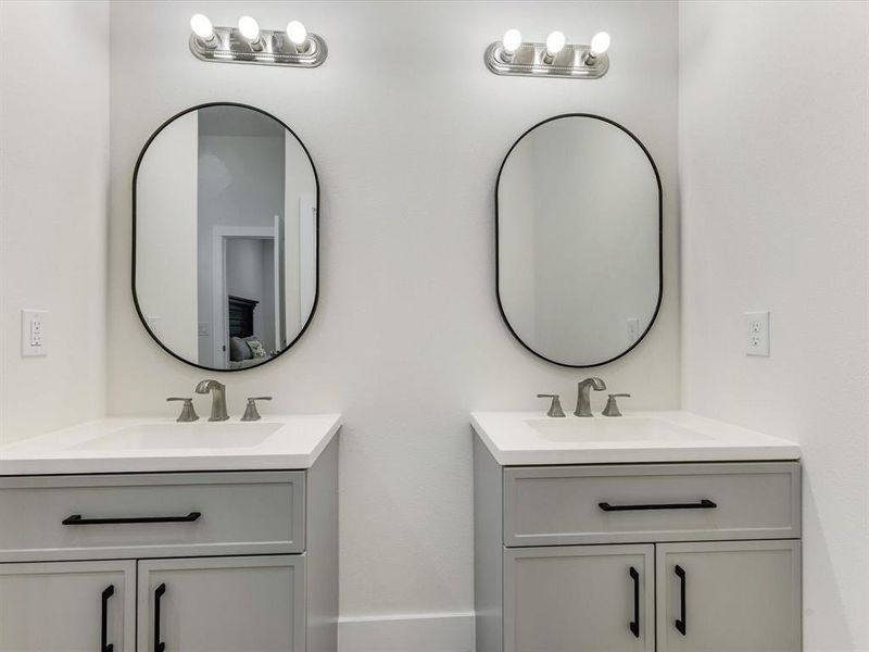 Bathroom featuring two vanities