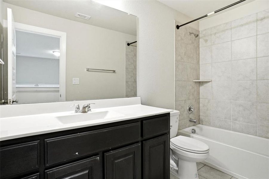 upstairs hall bath has  linen closet & portobello stained vanity cabinet