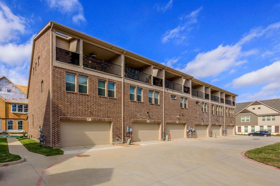 Newly constructed Townhouse end unit with third floor balcony and single door two car garage - View