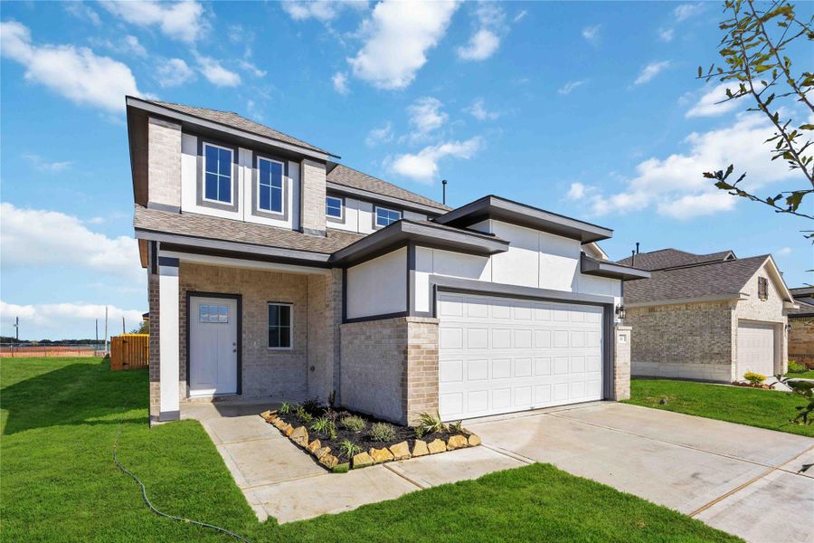 Front exterior of a new home in Tejas Village, Beasley, TX, highlighting curb appeal (Image 1).