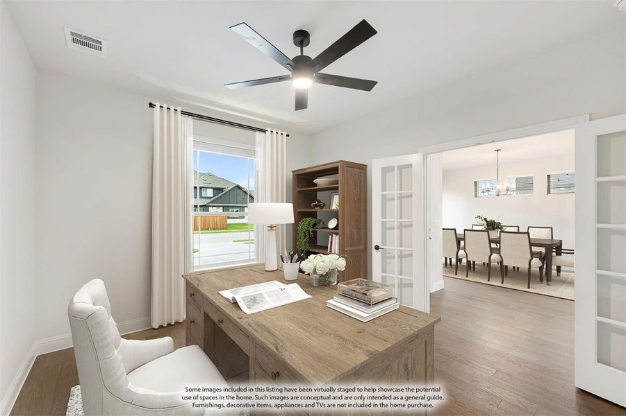 Home office with wood desk, ceiling fan, and French doors opening to dining room Home office with wood desk, ceiling fan, and French doors opening to dining room