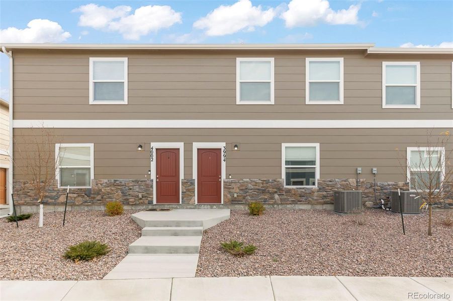 Front exterior of a new home in , Colorado Springs, CO, highlighting curb appeal (Image 20).