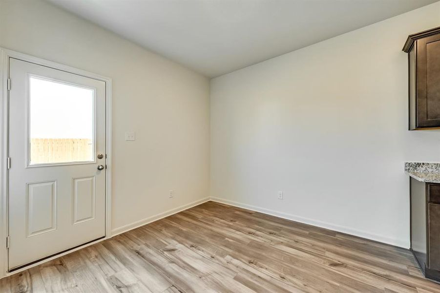 Dining room with light wood-style floors